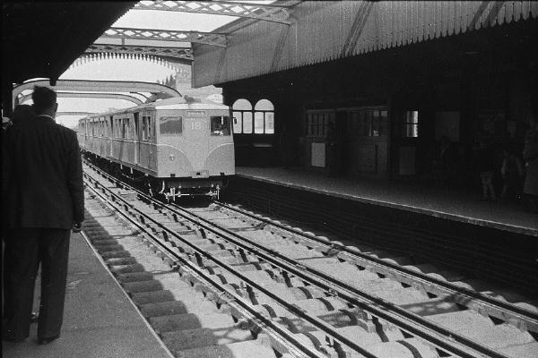 [Train entering station]