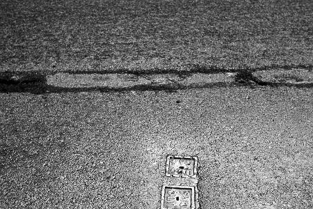 [Paved-over tram-rail]